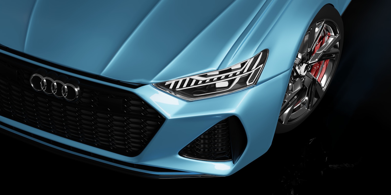 Photo by Ivan Bonadeo a close up of the front of a blue car - Audi