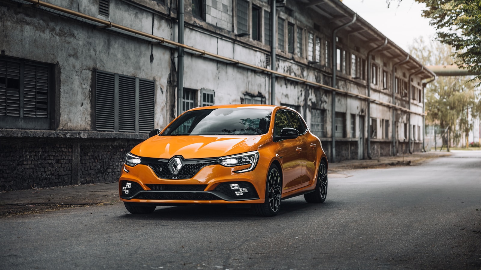 Photo by Martin Katler orange renault parked on street during daytime