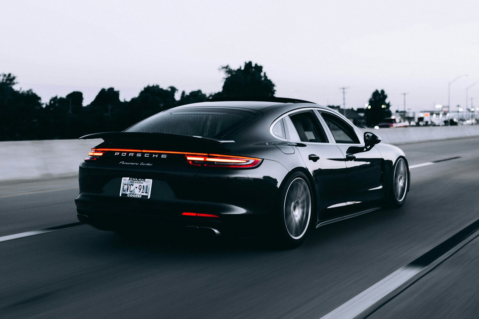 Photo by Campbell running black Porsche sedan