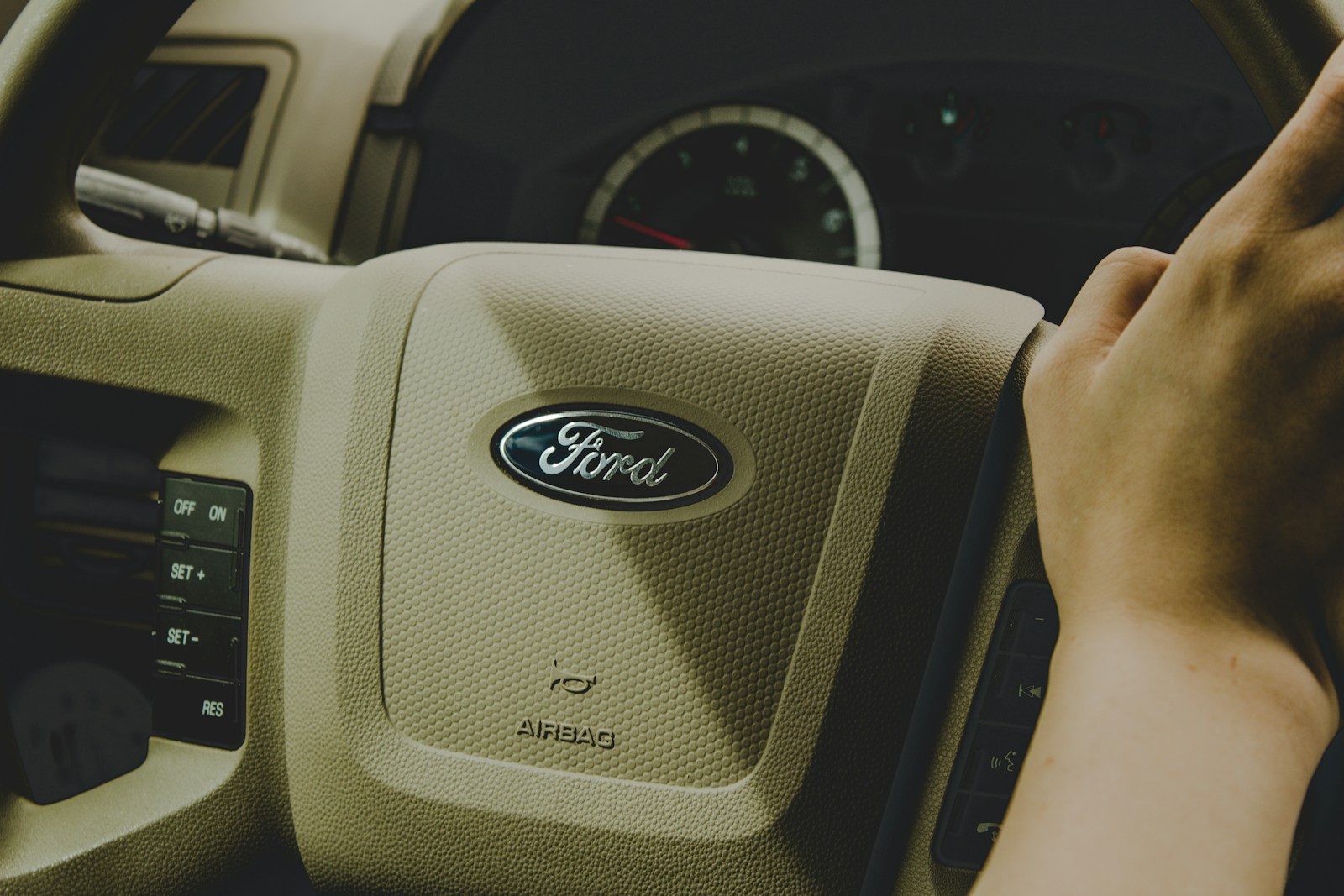 Photo by Nadine E person holding Ford steering wheel