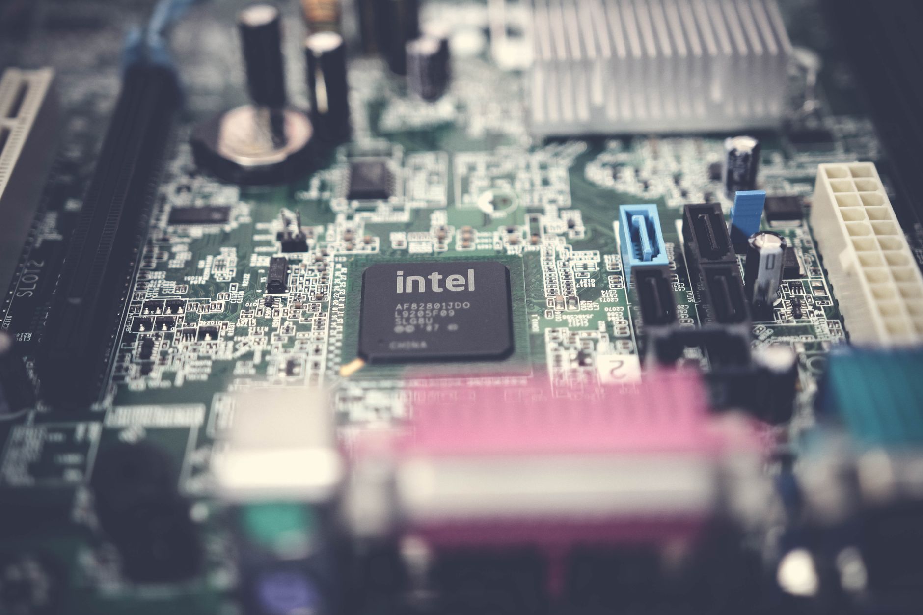 ECU cloning: engine control unit circuit board on a workshop bench